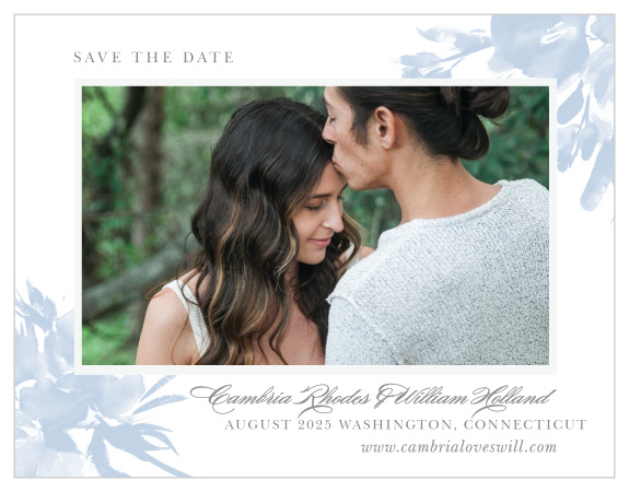 The Subtle Fleuriste Wedding Save-the-Date Cards border your engagement photo with a thick, white frame and soft blue, washed out blooms. 